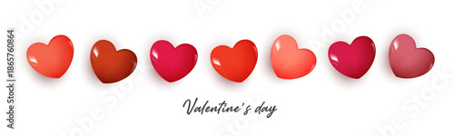 Valentine’s Day background with row of glossy pink and red heart shapes on white backdrop, romantic love concept for couples, wedding, anniversary, greeting card, banner, celebration and sweet.
