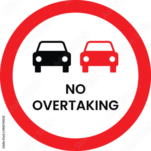 Red circle traffic sign with black and red cars and text N O V E R T A K I N G no overtaking prohibition