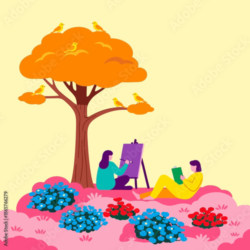 Two women relaxing and painting together outdoors under a tree.