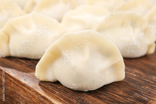 Canvas Print Fresh Handmade Dumplings on Wooden Board - Traditional Gourmet Food