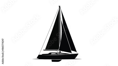A sleek black silhouette of a sailboat gliding across the water