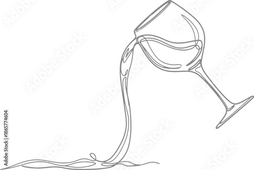 Wine glass spilling liquid on white background