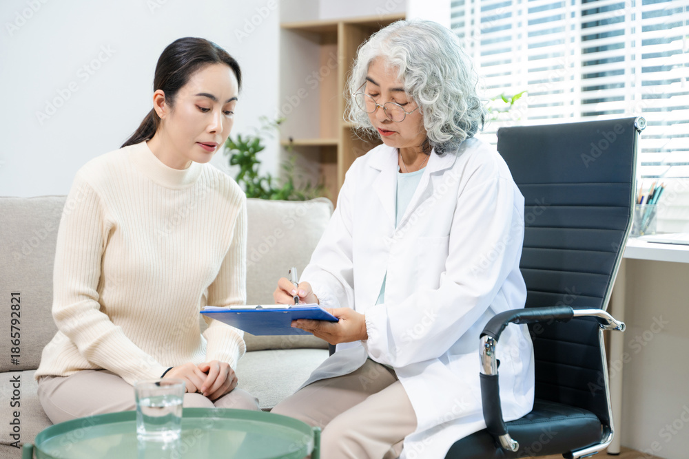 Fototapeta premium Psychiatrist comforting stressed patient during mental health therapy. Psychology counseling, emotional support, depression and anxiety treatment