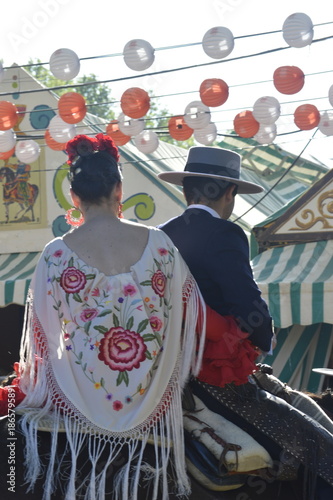 couple of riders in the world famous Feria de abril from Seville, Andalusia, Spain 
