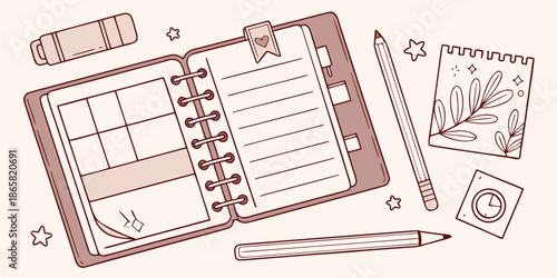 Overhead view of a cute open planner or organizer with writing tools and decorative notes representing goal setting and personal planning organization