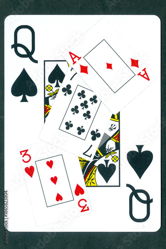 Obraz na plátně Playing cards: three of hearts, seven of clubs and ace of diamonds against the background of the Queen of Spades