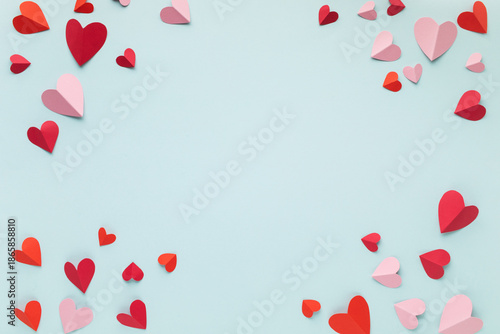 Love hearts on blue blank background. Valentine or Mother Day greeting card festive mockup. © juliasudnitskaya