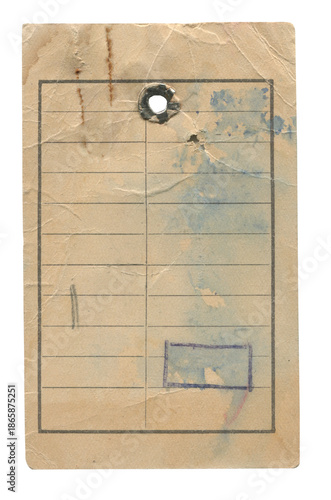Old clothes paper tag with punched hole, faded lines, ink stains and creases on white