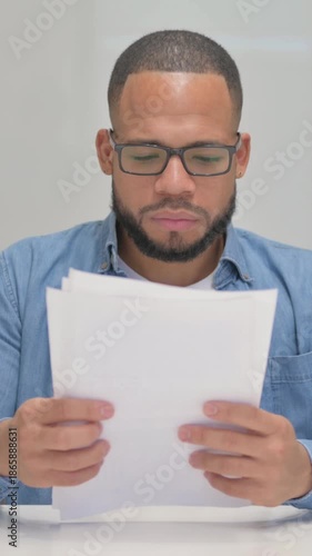 Mixed Race Man Working on Documents, vertical video