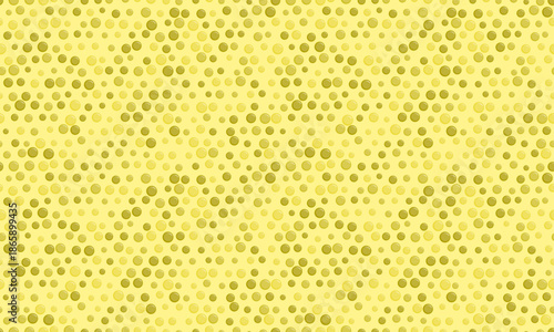 Abstract pastel yellow and green dotted pattern.  Seamless texture ideal for website backgrounds, presentations, and textile designs. Evokes feelings of calm and subtle energy.