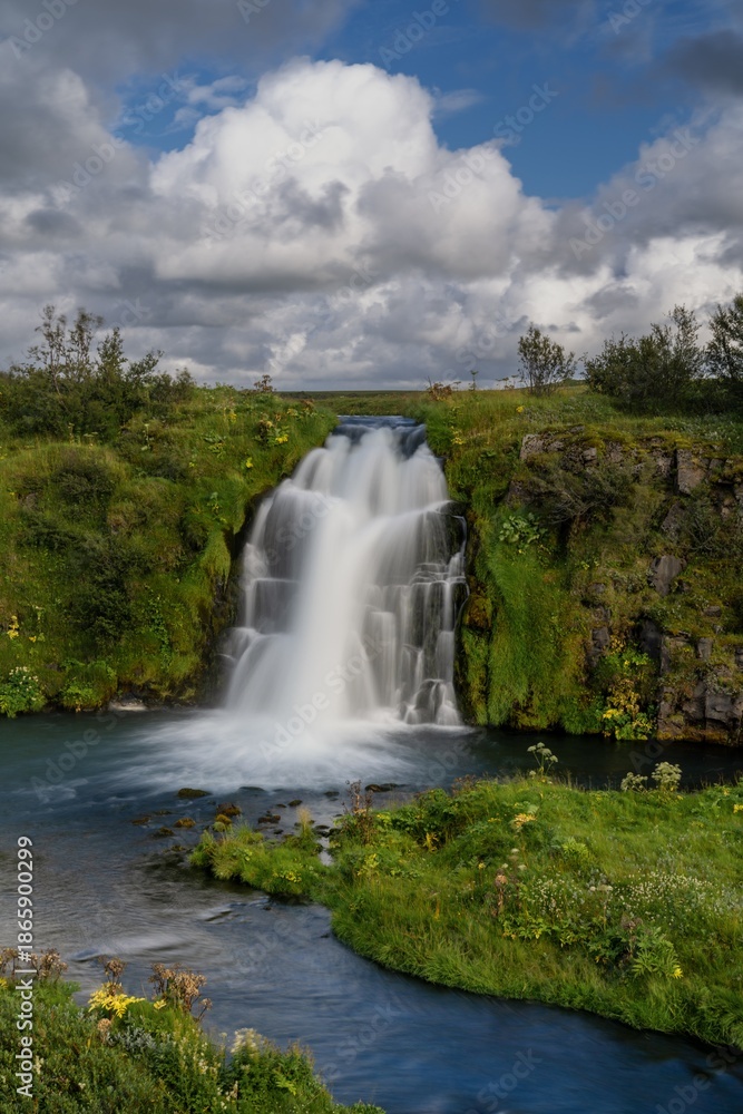 Fototapeta premium view of the left cascade of the Arbaejarfoss waterfall in southern Iceland near Hvolsvollur