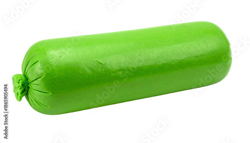 A green cylinder of packaged food product, isolated on black background