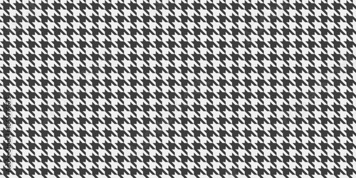 Sleek, repeating houndstooth pattern in classic black and white.  Perfect for textile design, fashion, website backgrounds, or adding a touch of timeless elegance to your projects.