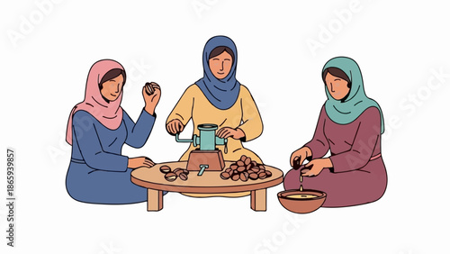 Three women in hijabs sit around a table, processing nuts with a grinder and collecting oil