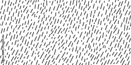 Black dashes and dots scattered across a white background abstract pattern texture