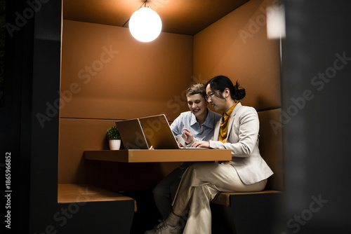 Business coworkers discussing project at modern office workspace
