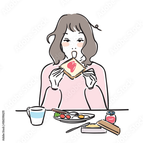 朝ごはんを食べる可愛い女性　トースト