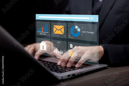 Digital marketing and analytics concept with business professional using laptop and virtual dashboard, showing email campaign metrics, open rate, click through data and performance analysis for busine