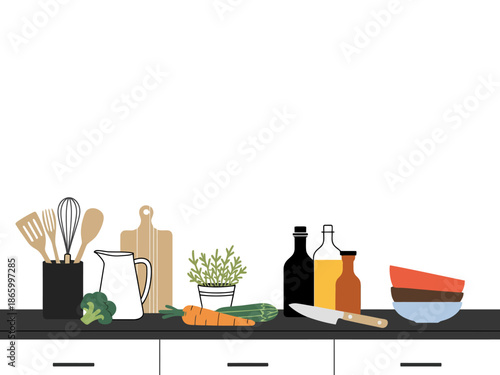 A kitchen counter with various cooking utensils and ingredients for healthy meal preparation