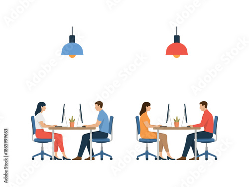 Four people working together at two desks with computers and lamps above them