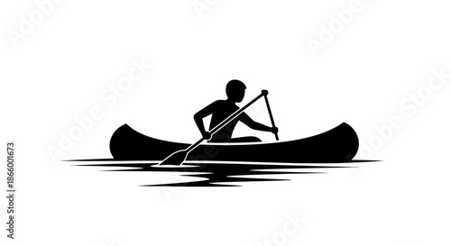 Black silhouette of a person paddling a canoe on water.