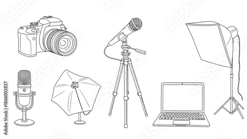 Photography equipment arranged on a plain white background with camera, tripod, and lighting