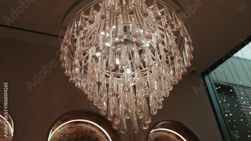 Close up view of crystal chandelier lighting interior space