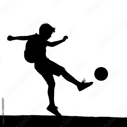 Silhouette of a Boy Kicking a Soccer Ball with Energy.