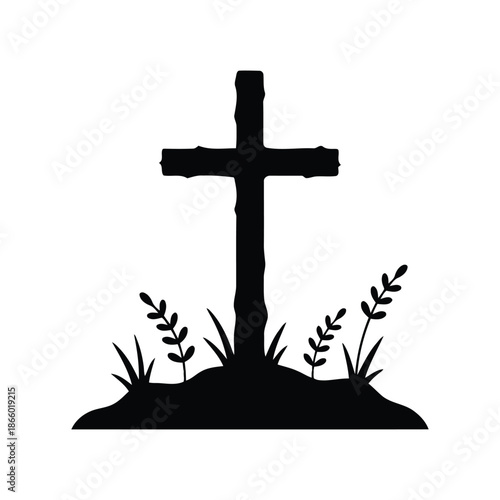 Silhouette of a christian cross standing in the ground with small plants growing around it