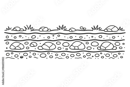 Layered soil cross-section with grass and rocks