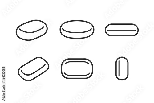 Six abstract minimalist pills or capsules on a grey background