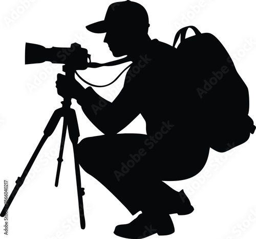 A silhouette of a wildlife photographer capturing images with a professional camera setup