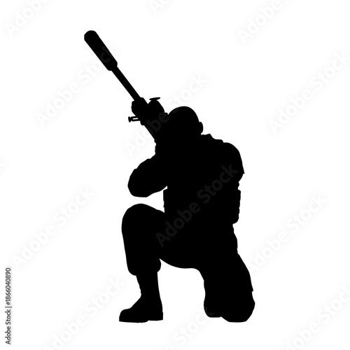 Silhouette of a kneeling soldier aiming a sniper rifle, ready for action.