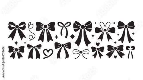Collection of black and white decorative bows and ribbons on a clean white background