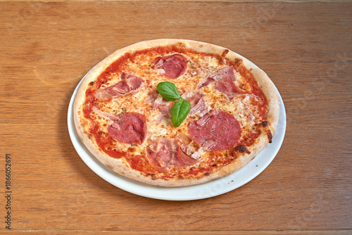 Wallpaper Mural Pizza salami and ham on white plat on wooden table Torontodigital.ca