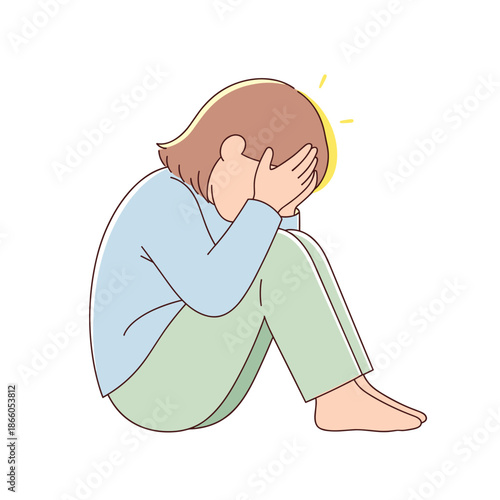 Young person sitting with head in hands expressing sadness  