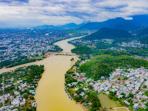A muddy river during the rainy season. The Kai River in Nha Trang, Vietnam. During the rainy season, the river is replenished with water from the mountains and turns dirty due to the muddy bottom. 