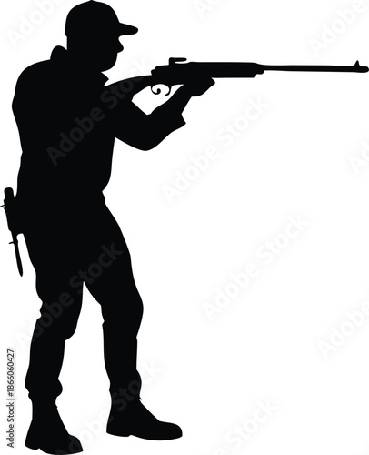 A silhouetted figure of a man aiming a rifle showcasing target practice or