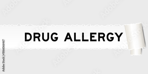 Ripped gray paper background that have word drug allergy under torn part
