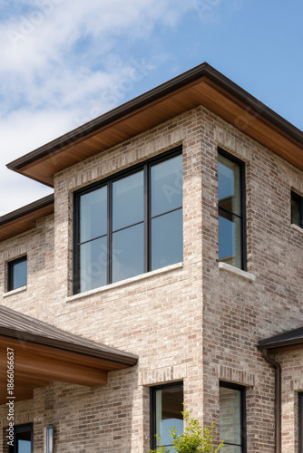 Wallpaper Mural Close-up capturing architectural details: brick, large windows, and modern design. Torontodigital.ca