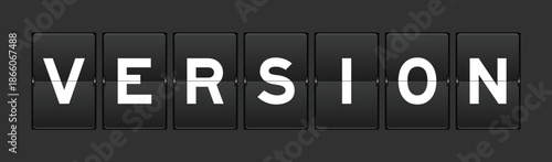 Black color analog flip board with word version on gray background