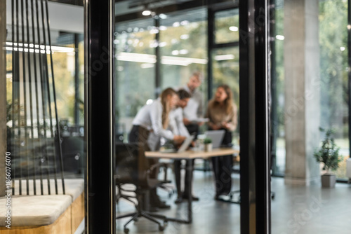 Photos Businessmen blur in the workplace in office with computer or shallow depth of fo