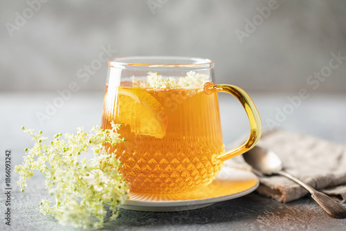 Herbal Tea with Elder flower on wooden background. Healing drink
