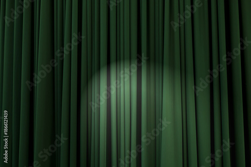 Background texture of dark green, heavily corrugated curtain with stage light in the middle