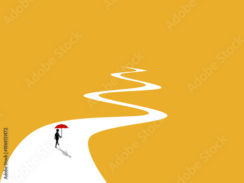 businessman was walking along a long road holding an umbrella