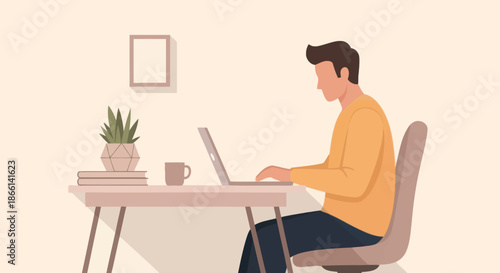 Man working on a laptop at a desk.