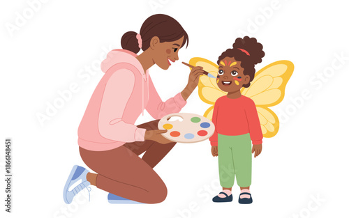 A woman applying face paint to a young girl dressed as a butterfly in a playful scene