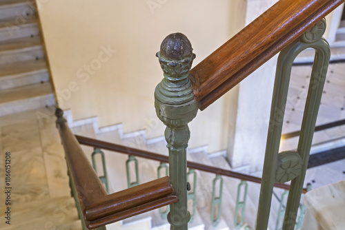 Fotografie Interior view of the Apollon Theater in Ermoupolis, Syros, Greece, showing a descending staircase with green-painted balusters and dark wooden handrails