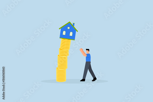 Property market collapse, real estate agent helps protect the house from a falling unstable stack of coins