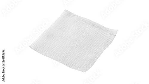 Single white gauze pad with textured surface isolated on black background medical sterile